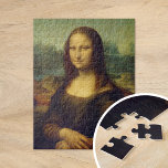 Puzzle Mona Lisa | Leonardo da Vinci<br><div class="desc">Mona Lisa (1503-1506) del artista renacentista italiano Leonardo da Vinci. El trabajo original es aceite en paneles de madera de álamo. Se cree que esta famosa pintura es un retrato de Lisa Gherardini, y ha sido aclamada como "la más conocida, la más visitada, la más escrita, la más cantada, la...</div>