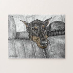 Puzzle Montar a caballo del Doberman en coche