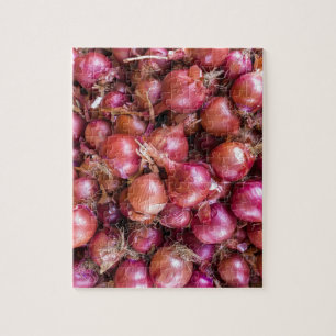 Puzzle Montón de cebollas rojas en mercado