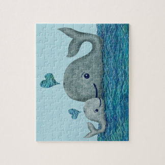 Puzzle Natación de la mamá y del bebé de la ballena en el