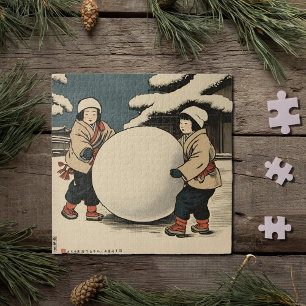 Puzzle Niños japoneses rodando grandes bolas de nieve
