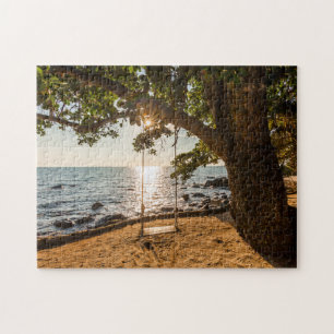 Puzzle Oscilación en la playa en la puesta del sol