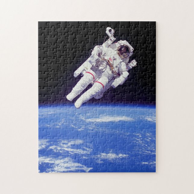 Puzzle Paseo espacial con mochila propulsora de astronaut (Vertical)