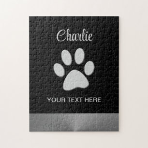 Puzzle Paw de perro plateado sobre fondo negro