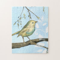 Pequeño pájaro amarillo encaramado en una rama mir