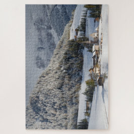 Puzzle Pequeño pueblo en la nieve en las montañas en