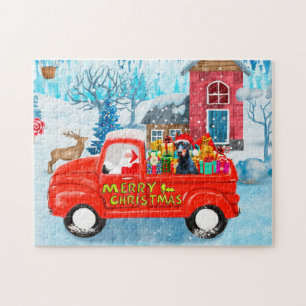 Puzzle Perro Doberman en la nieve de un camión Navidad