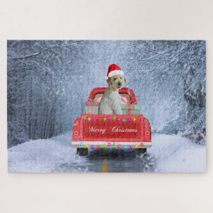 Puzzle Perro Goldendoodle en la nieve sentado en Navidad 