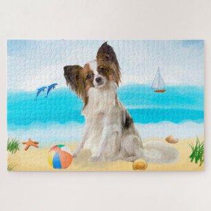 Puzzle Perro Papillon en la playa