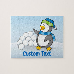 Puzzle Pingüino pequeño con bolas de nieve ondeando