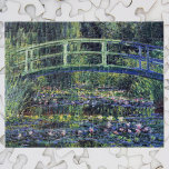 Puzzle Puente sobre estanque acuático por Claude Monet<br><div class="desc">Bridge Over Waterlily Pond de Claude Monet es un bonito cuadro de arte de estilo vintage que presenta un puente sobre flores de lirio en un estanque en el jardín de Monet en su casa en Giverny, Francia. Claude Monet disfrutó pintando "al aire libre" o "al aire libre". Una serie...</div>