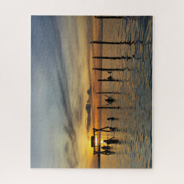 Puzzle Puesta de sol con postes de madera en el agua