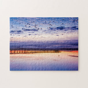 Puzzle Puesta de sol sobre el muelle y la playa de Ventur