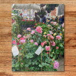 Puzzle Rosas<br><div class="desc">Este rompecabezas muestra una foto de un puesto vendiendo rosas rosas rosadas en un mercado en Francia.</div>