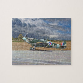 Puzzle Spitfire debajo de las nubes de tormenta