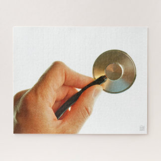Puzzle Stethoscoop in een hand voor een ziekenhuis sfeer.