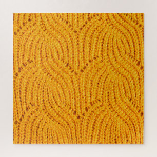 Puzzle Suéter de punto naranja, fondo texturado.