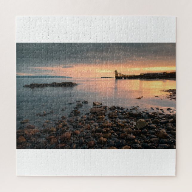 Puzzle Sunset de rock negro en la playa Salthill en Galwa (Vertical)