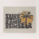 Puzzle Surf Sand Sunsets Beach Life Palm Tree<br><div class="desc">La camiseta "Surf Sand Sunsets" es la adición perfecta a tu armario de verano. Ya sea que estés golpeando las olas o simplemente descansando en la arena,  este té te ha cubierto. Preparémonos para un verano lleno de olas,  arena y puestas de sol inolvidables.</div>