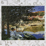 Puzzle The Bank of the Seine, Bennecourt by Claude Monet<br><div class="desc">On the Bank of the Seine, Bennecourt (1869) by Claude Monet is a vintage impressionism fine art nature painting. A portrait of a woman sitting under a shade tree on the banks of the Seine River. She is sitting near boats and rowboats with buildings on the other side of the...</div>