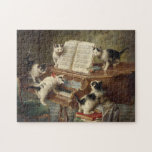 Puzzle The Kittens’ Recital | Carl Reichert<br><div class="desc">The Kittens’ Recital (1908) | Carl Reichert’s The Kittens’ Recital is a charming and imaginative painting featuring five adorable kittens gathered around a piano, seemingly performing a recital. Each kitten’s unique pose and playful expression bring personality to the scene, while the finely rendered piano and cozy interior add depth and...</div>