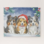 Puzzle Three Cute Christmas Shelties in the Snow<br><div class="desc">This adorable puzzle features a watercolor painting of three shelties sitting in the snow. The sheltie in the middle is wearing Santa's hat</div>