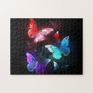 Puzzle Tres mariposas brillantes en el fondo nocturno
