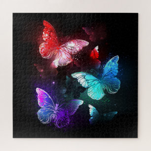 Puzzle Tres mariposas brillantes sobre fondo nocturno