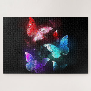 Puzzle Tres mariposas brillantes sobre fondo nocturno