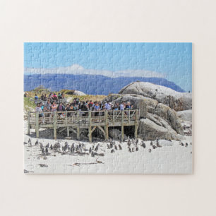 Puzzle Turistas en la playa de los cantos rodados que