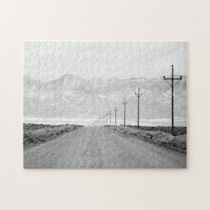 Puzzle Un camino solitario y montañas de las líneas