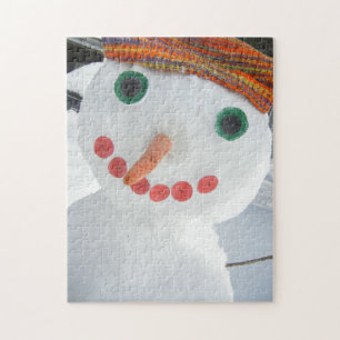 Puzzle Un gracioso muñeco de nieve usando Gorra Naranja f