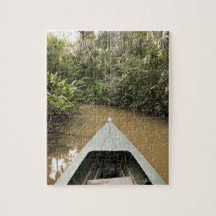 Puzzle Una canoa de madera hecha del árbol de Eucylptus