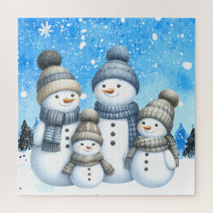 Puzzle Una familia de muñecos de nieve en la nieve