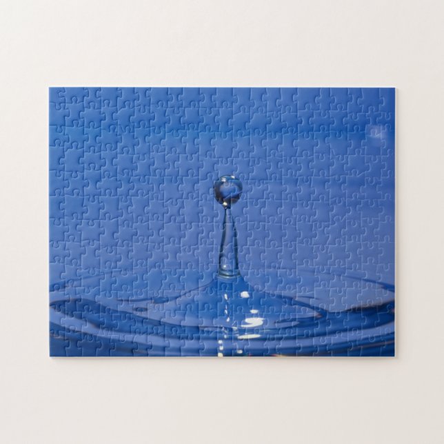 Puzzle Una gota azul de agua en movimiento sobre un rompe (Horizontal)