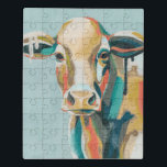 Puzzle Vaca colorida<br><div class="desc">Esta impresión de color muestra un retrato en naranja y verde azulado | Por Grace Popp</div>