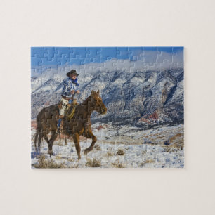 Puzzle Vaquero a caballo que lleva chaparreras de cuero