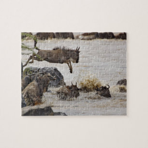 Puzzle Wildebeest saltando al río Mara
