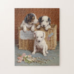 Puzzle With Heaty Guud Wishes | Carl Reichert<br><div class="desc">With Heaty Guud Wishes | Carl Reichert’s With Hearty Good Wishes is a delightful painting featuring adorable puppies nestled together in a woven basket. Their curious expressions and soft fur are rendered with exquisite detail, exuding warmth and affection. The cozy composition, paired with the charming title, conveys a sense of...</div>