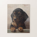 Puzzle Young Dachshund | Carl Reichert<br><div class="desc">Young Dachshund | Carl Reichert’s Young Dachshund is a heartwarming portrait of a dachshund puppy, showcasing the artist’s remarkable attention to detail and ability to capture the animal’s endearing expression. The puppy’s soulful eyes and soft fur are rendered with exquisite precision, set against a neutral background that emphasizes the subject’s...</div>