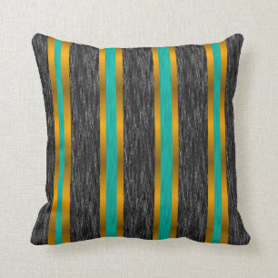 Rayas verde azuladas del oro en la almohada negra
