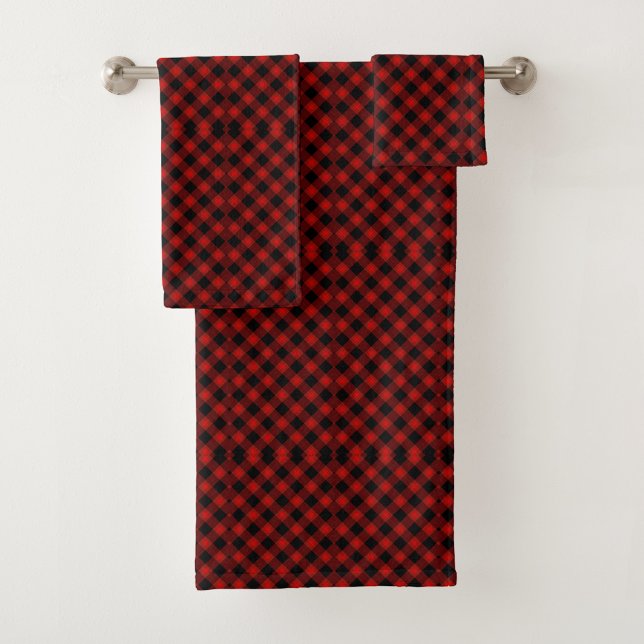 Red and black plaid towels hang on a silver towel (Subido por el creador)
