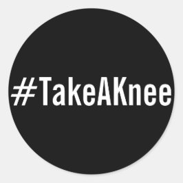 Redonda #TakeAKnee, texto blanco en negrita sobre pegatina