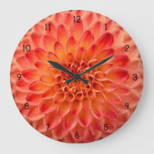 Reloj anaranjado de la flor de la dalia