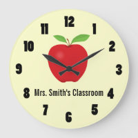 Reloj de aula con una manzana