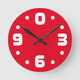 Redondo Mediano Reloj con números cero, tres, seis y nueve.