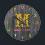 Redondo Mediano Reloj personalizado de color inspirado en madera g<br><div class="desc">Un reloj con una foto de madera de pino como fondo. Los números son rosa,  blanco,  naranja,  amarillo,  morado y verde. Personaliza con tu nombre y al principio en el centro.</div>
