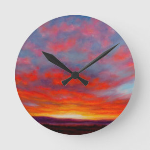 Redondo Mediano Salida del sol en las montañas del reloj de