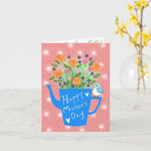 Regadera con flores y tarjeta del día de la madre