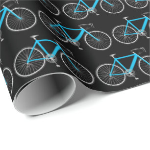 Regalo bicicleta acuática sobre papel de envoltura negro